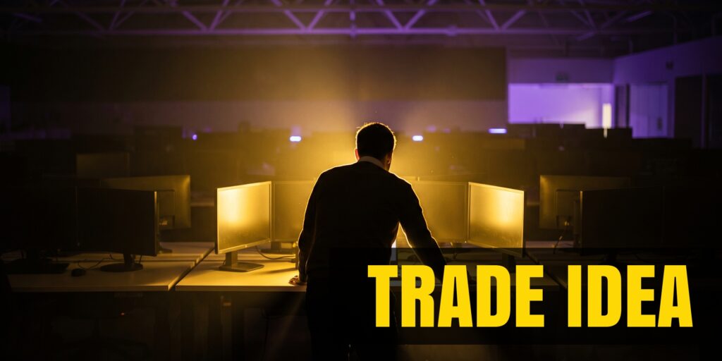 Sotet trading floor egyetlen kivilagitott munkaallomassal, arany es lila fenyekkel